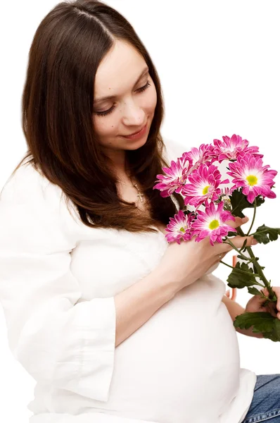 Όμορφη έγκυο γυναίκα με λουλούδια — Φωτογραφία Αρχείου