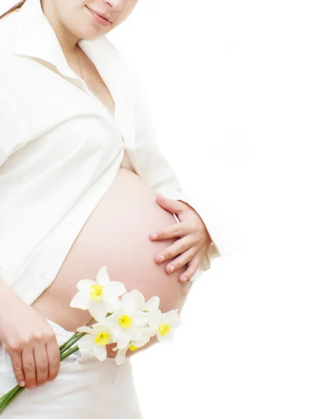 Teil der schwangeren Frau mit Blume Stockbild