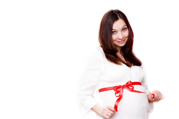 Έγκυος γυναίκα με κόκκινο τόξο — Φωτογραφία Αρχείου