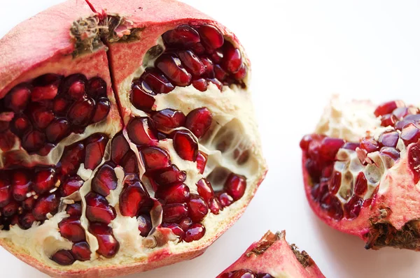 Pomegranate divided into parts — Stock Photo, Image