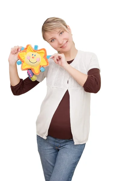 Donna sorridente che tiene il giocattolo soleggiato — Foto Stock