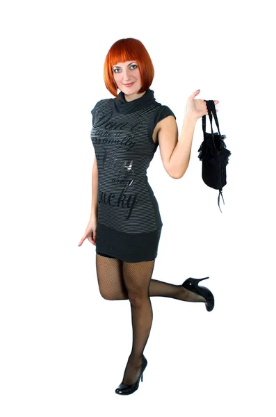 Dívka v krátké šaty s taškou — Stock fotografie