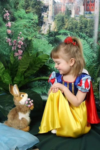 Girl dressed as Snow White and the hare — Stock Photo, Image