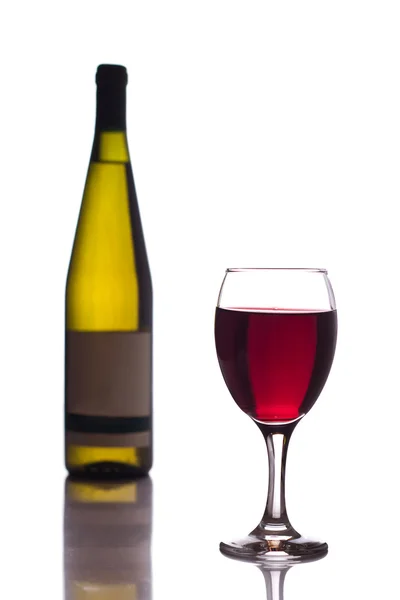 Palack és pohár vörösbor — Stock Fotó