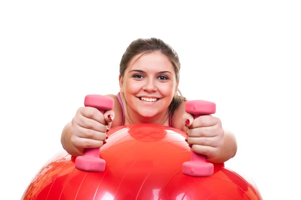 Meisje in roze oefenen met gewichten — Stockfoto
