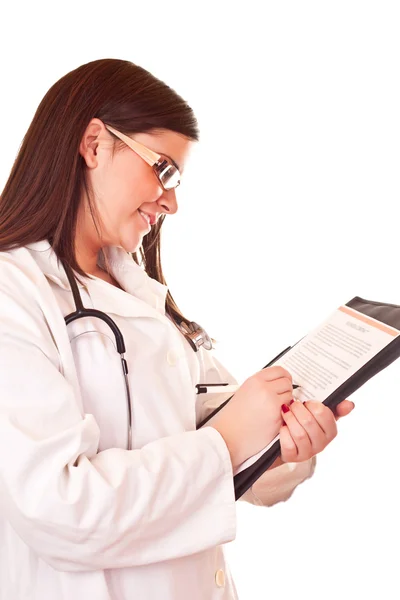 Kobieta lekarz pisanie na papierze — Zdjęcie stockowe