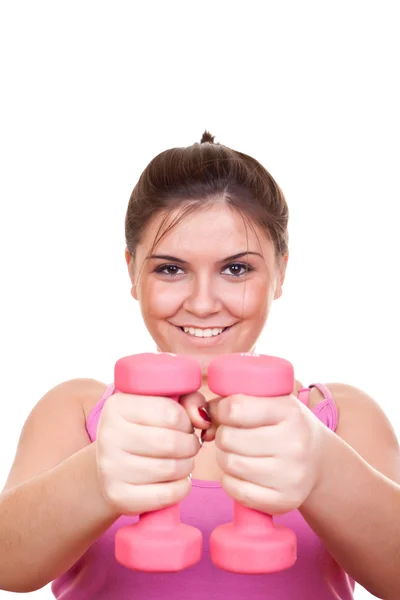 Menina em rosa segurando peso — Fotografia de Stock