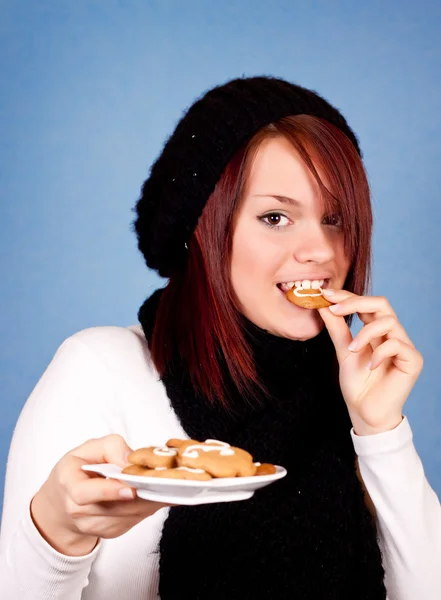 Meisje eten cookies — Stockfoto