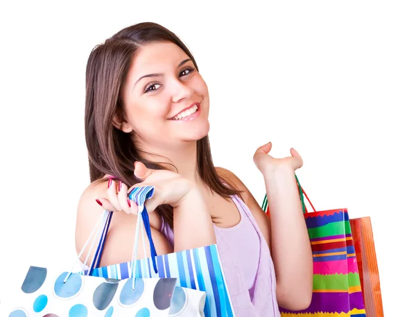Fiatal nő, színes papír táskák — Stock Fotó