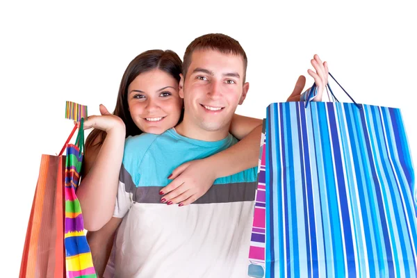 Casal sorridente com sacos de compras — Fotografia de Stock