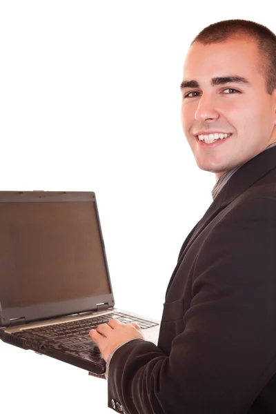 Ноутбук и улыбающийся бизнесмен — стоковое фото