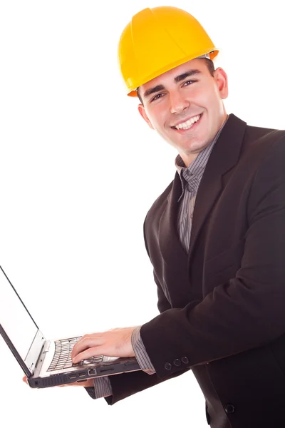 Businessman with helmet and laptop — Stock Photo, Image