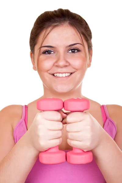 Девушка держит вес для упражнений — стоковое фото