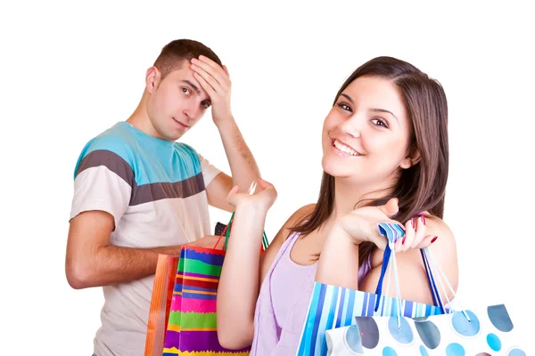 Man with wallet and woman with bags — Stock Photo, Image