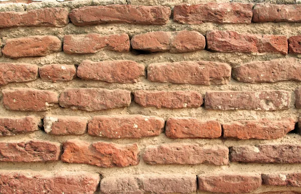 Turuncu tuğla duvarın arka