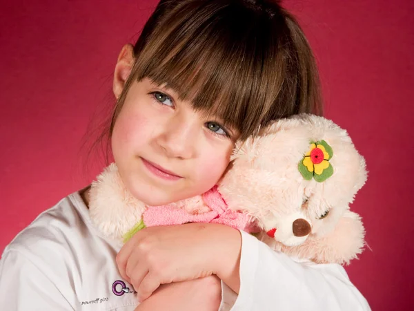 Girl with doll — Stock Photo, Image