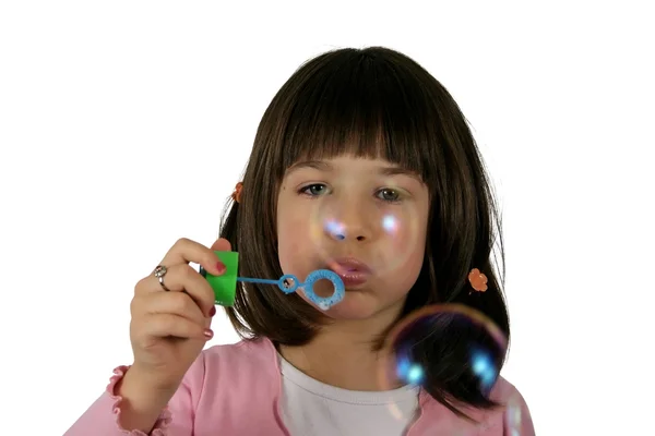 Dziewczyna wieje balon — Zdjęcie stockowe