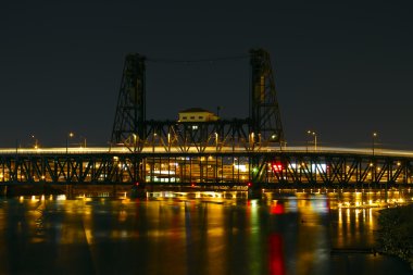 Train Light Trails Over Steel Bridge clipart