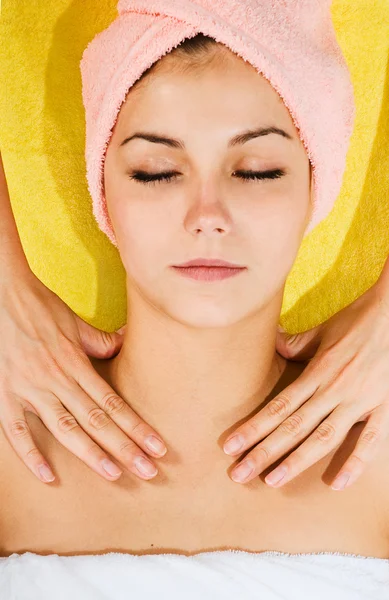 Beautiful young woman receiving massage — Stock Photo, Image