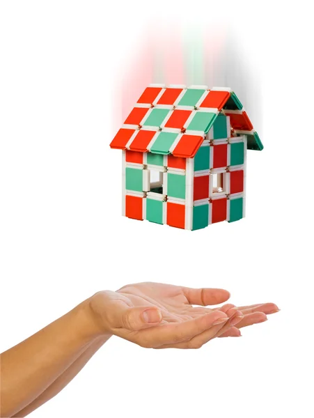 The house is falling down to human hands — Stock Photo, Image