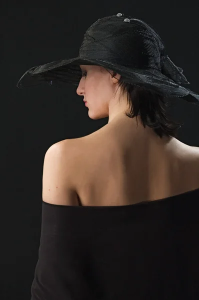 Pretty woman with a hat on her head — Stock Photo, Image