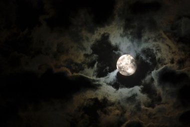 Full moon and eerie white clouds clipart