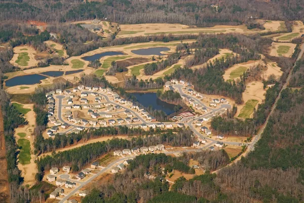 stock image Aerial view of a golf course and houses