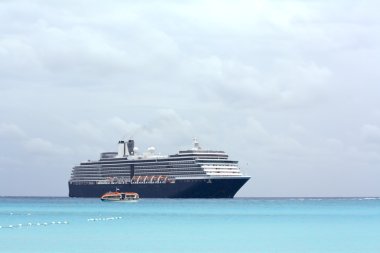 Cruise ship and cloudy skies clipart