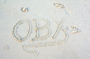 OBX abbreviation written in the sand clipart