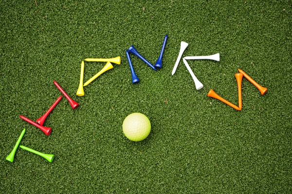 Golf tee dzieki — Zdjęcie stockowe