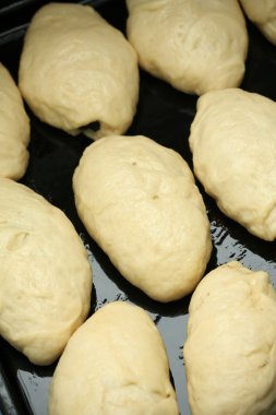 Raw pie dough in a brazier clipart
