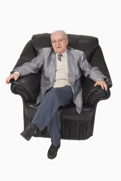 Senior in an armchair — Stock Photo, Image