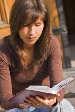 Girl student reading clipart