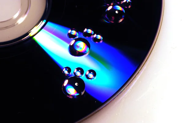 Water drops on cd background — Stock Photo, Image