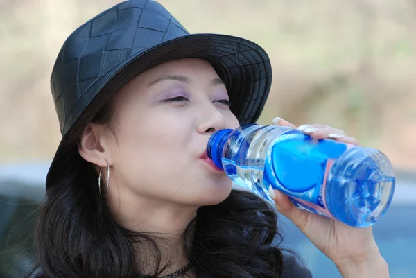 stock image Beautiful girl drink with a bottle