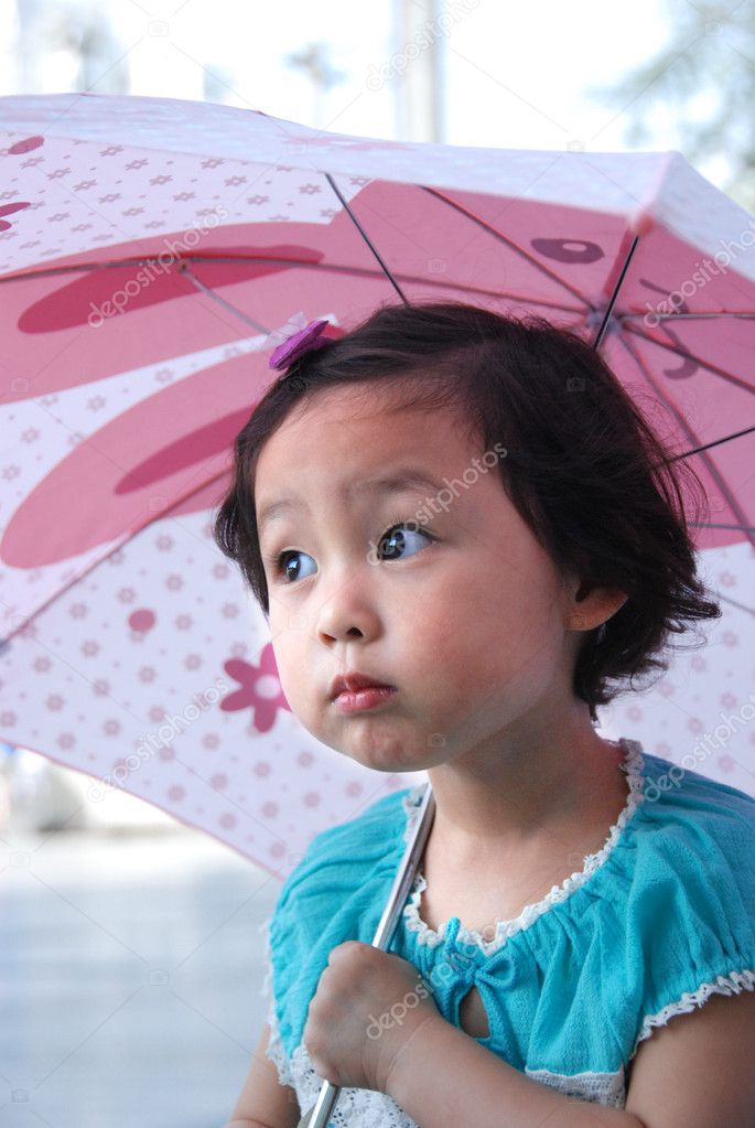 Little girl hold umbrella