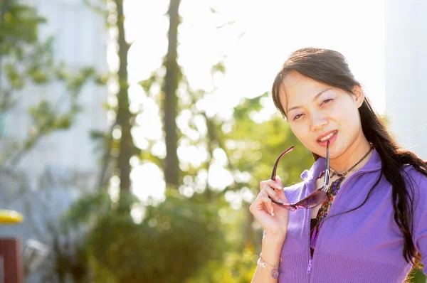 Fashion girl with sunglasses in purple — Stock Photo, Image