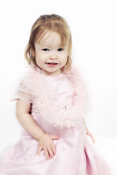 Kislány, rózsaszín ruha, fehér háttér — Stock Fotó
