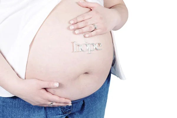 Señal de esperanza en el vientre de la mujer embarazada — Foto de Stock