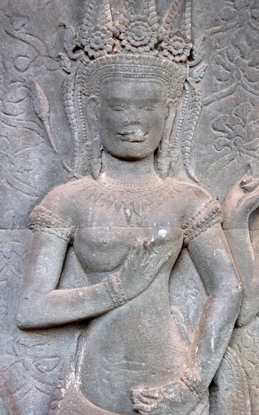 Rosto de pedra esculpida em um templo — Fotografia de Stock