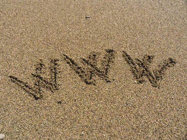 Inscrição na areia do mar WWW — Fotografia de Stock
