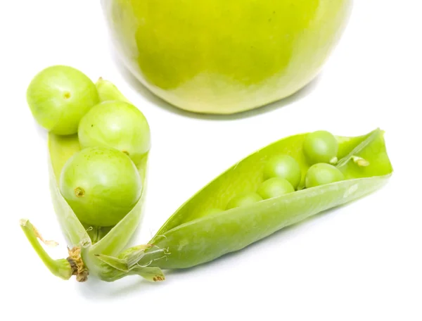Pods of a green peas, plum and apple — Stock Photo, Image