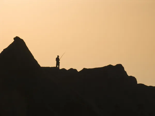 stock image Silhouette of the fisherman