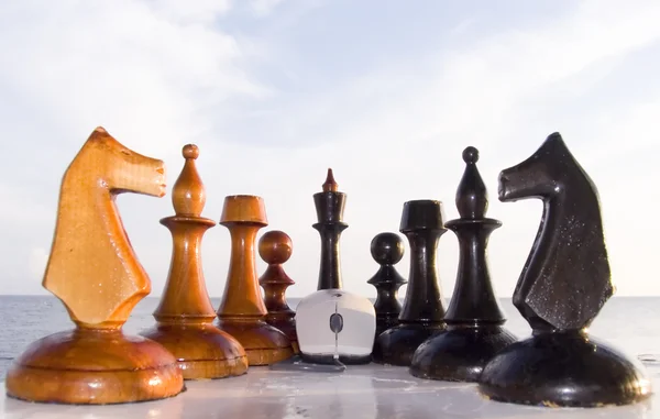 stock image Chessmen and the computer mouse