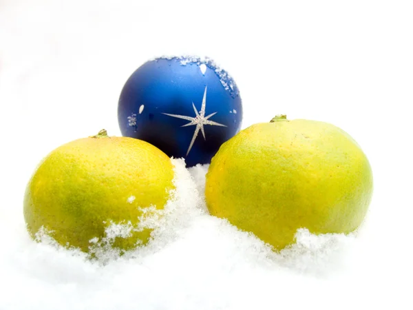 stock image Two tangerines and a christmas sphere