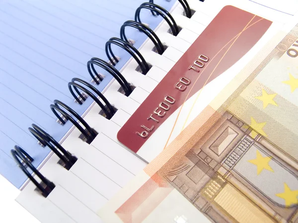 Notebook with Euro and a credit card — Stock Photo, Image