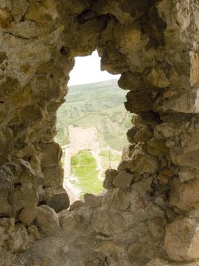 Window in an old stone fortress clipart