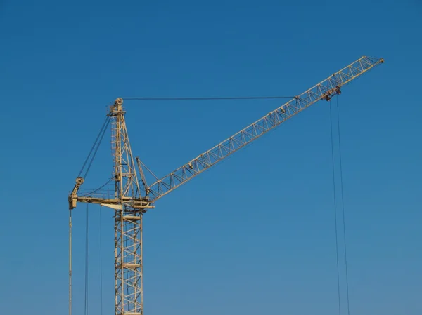 stock image Yellow crane on blue sky