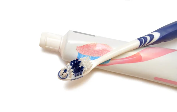 Een tandenborstel en tand plakken — Stockfoto