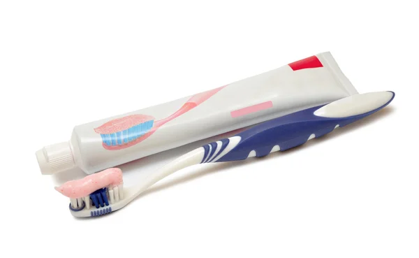 Cepillo de dientes al lado de pasta de dientes —  Fotos de Stock